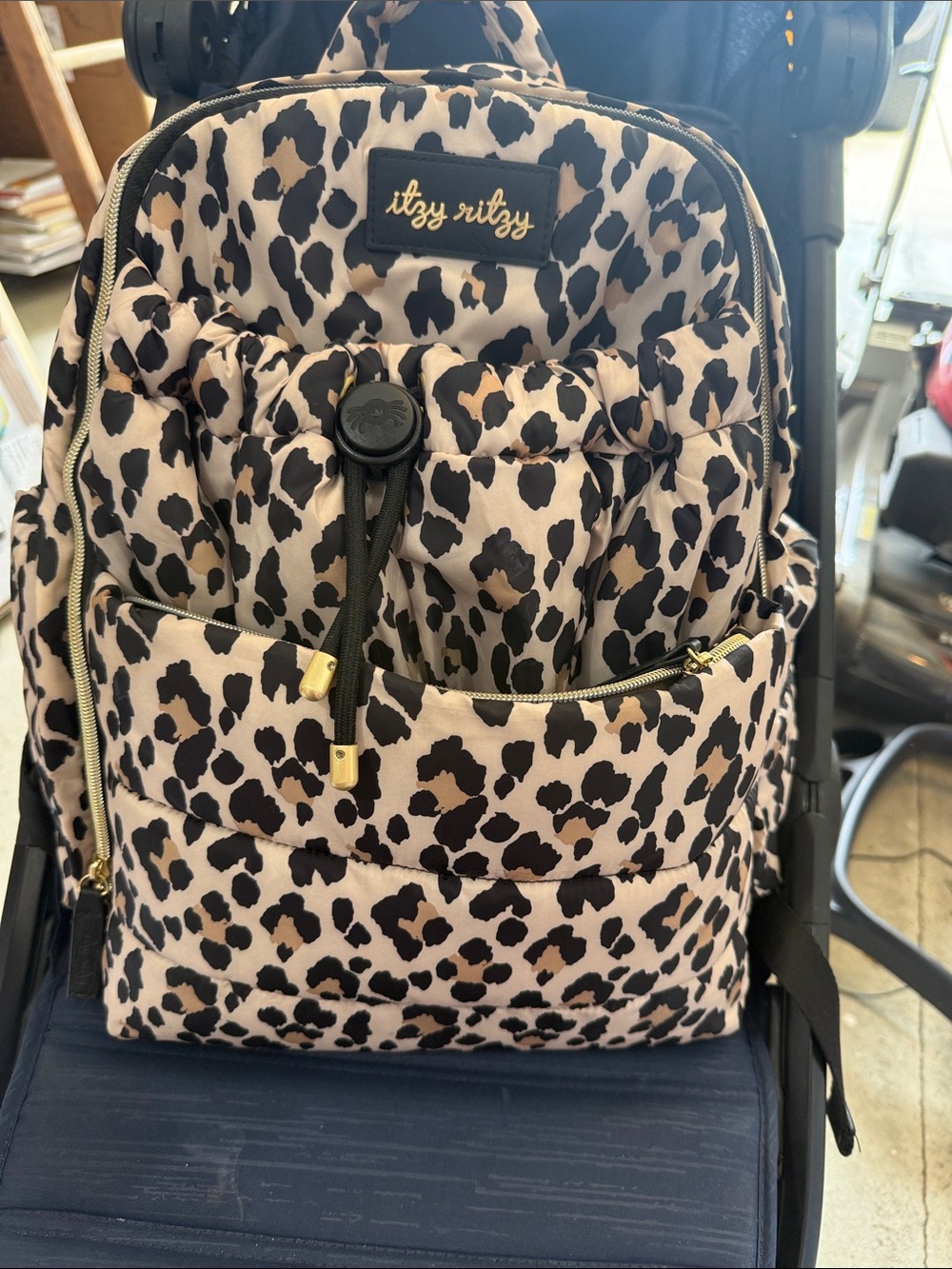Itzy Ritzy Leopard Print Backpack in Beige and Black
